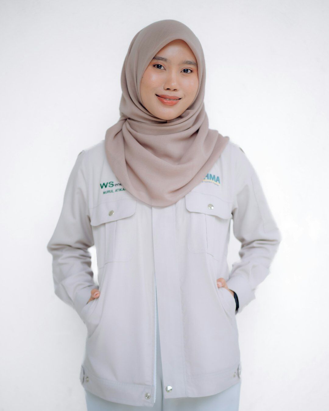 Headshot of a Malay woman software engineer smiling
